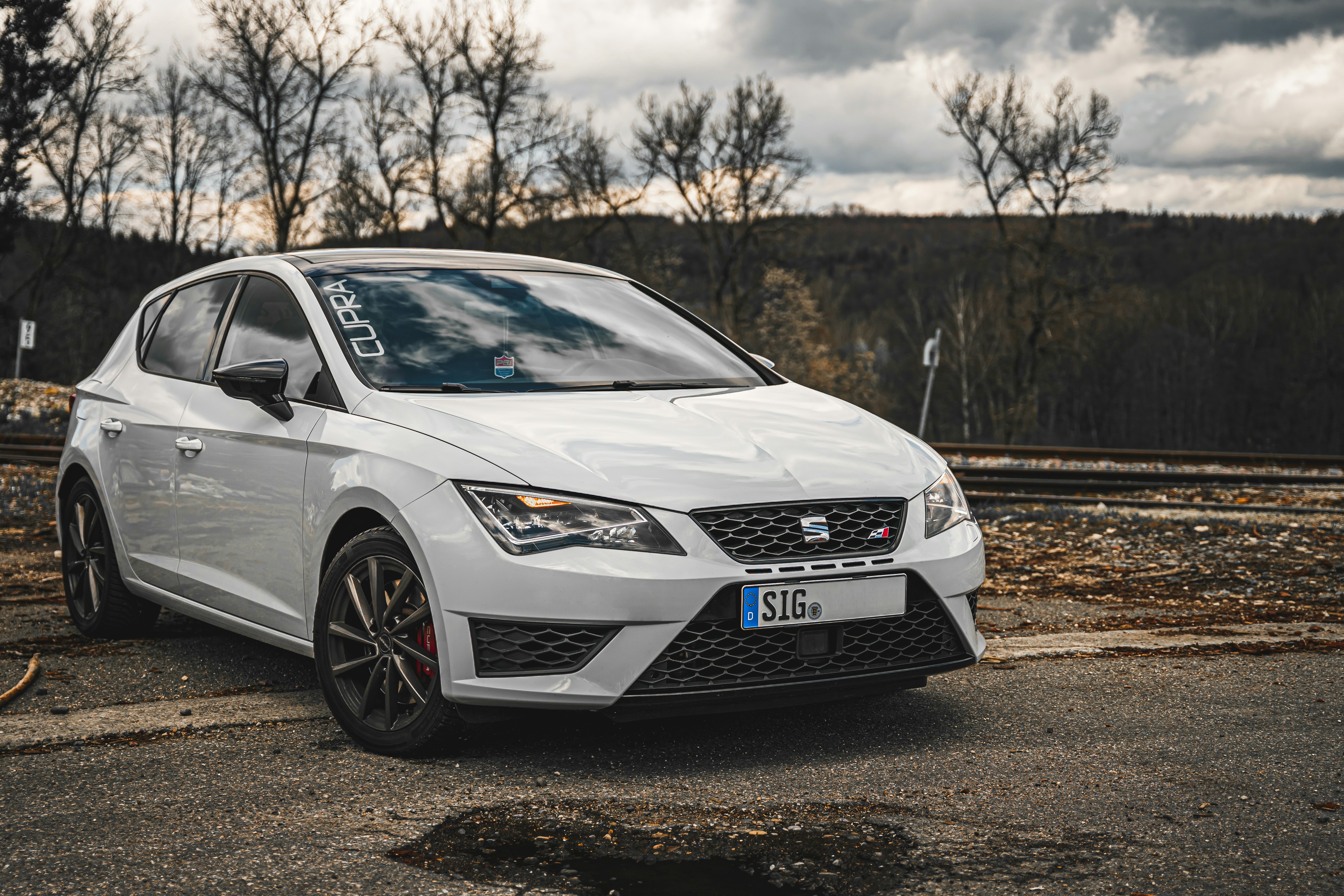 white honda car on dirt road during daytime